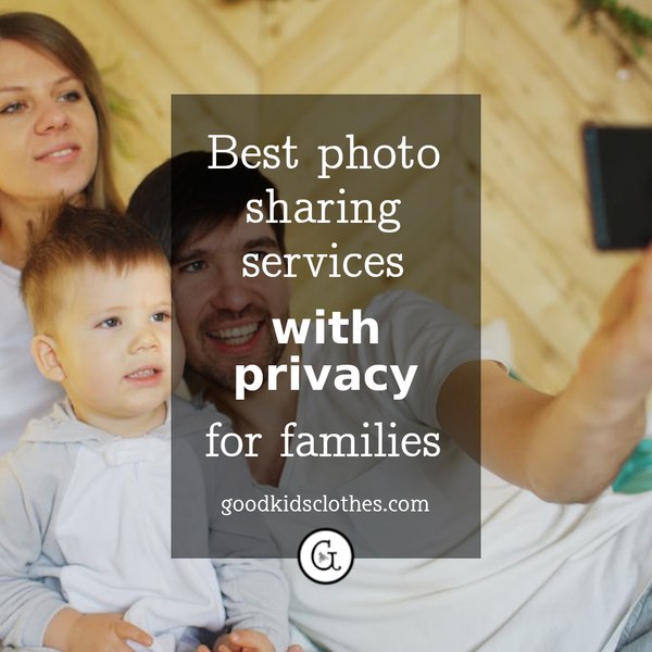 father taking photo of wife and toddler