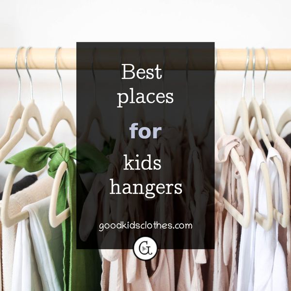kids clothes on hangers in closet
