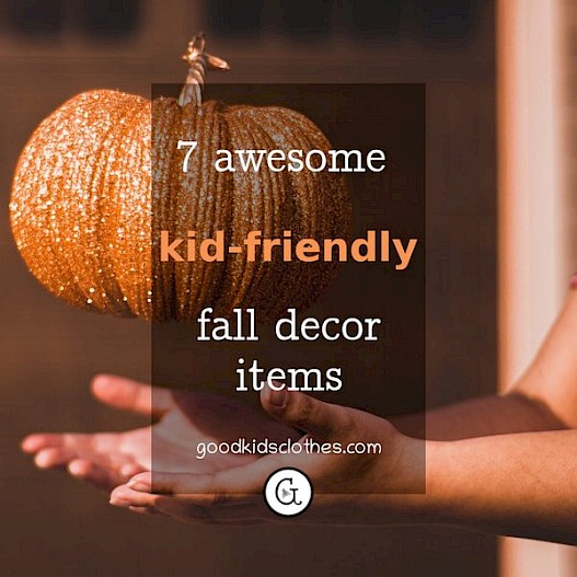 child playing with a pumpkin for fall decorating ideas